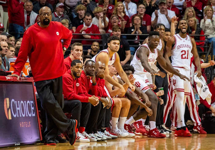 Indiana Head Coach Mike Woodson and the coaching staff wear red sweaters during the first half of the Indiana versus Army men's basketball game at Simon Skjodt Assembly Hall.